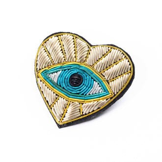 Embroidered patch as a brooch, gold evil eye