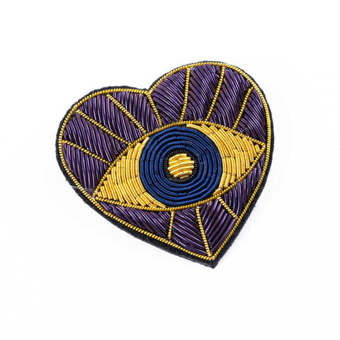 Embroidered patch as a brooch, gold evil eye