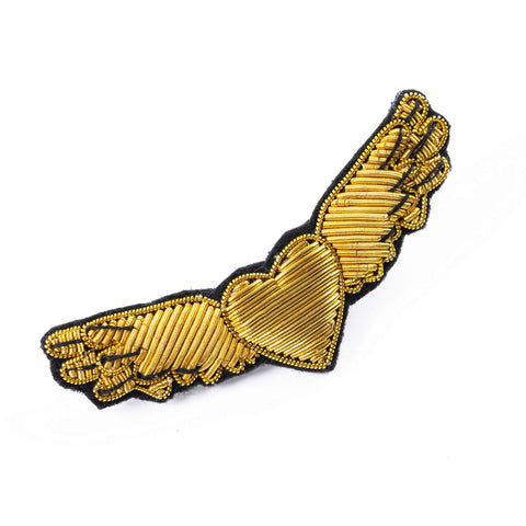 Embroidered patch as a brooch, gold wings